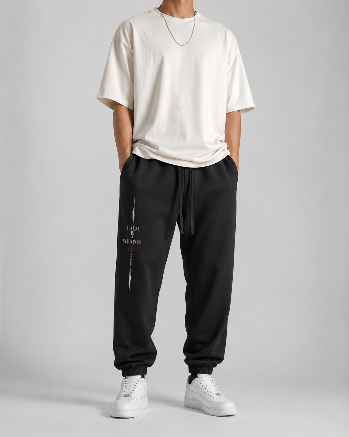 Calm Is A Weapon sweatpants typography graphic detail