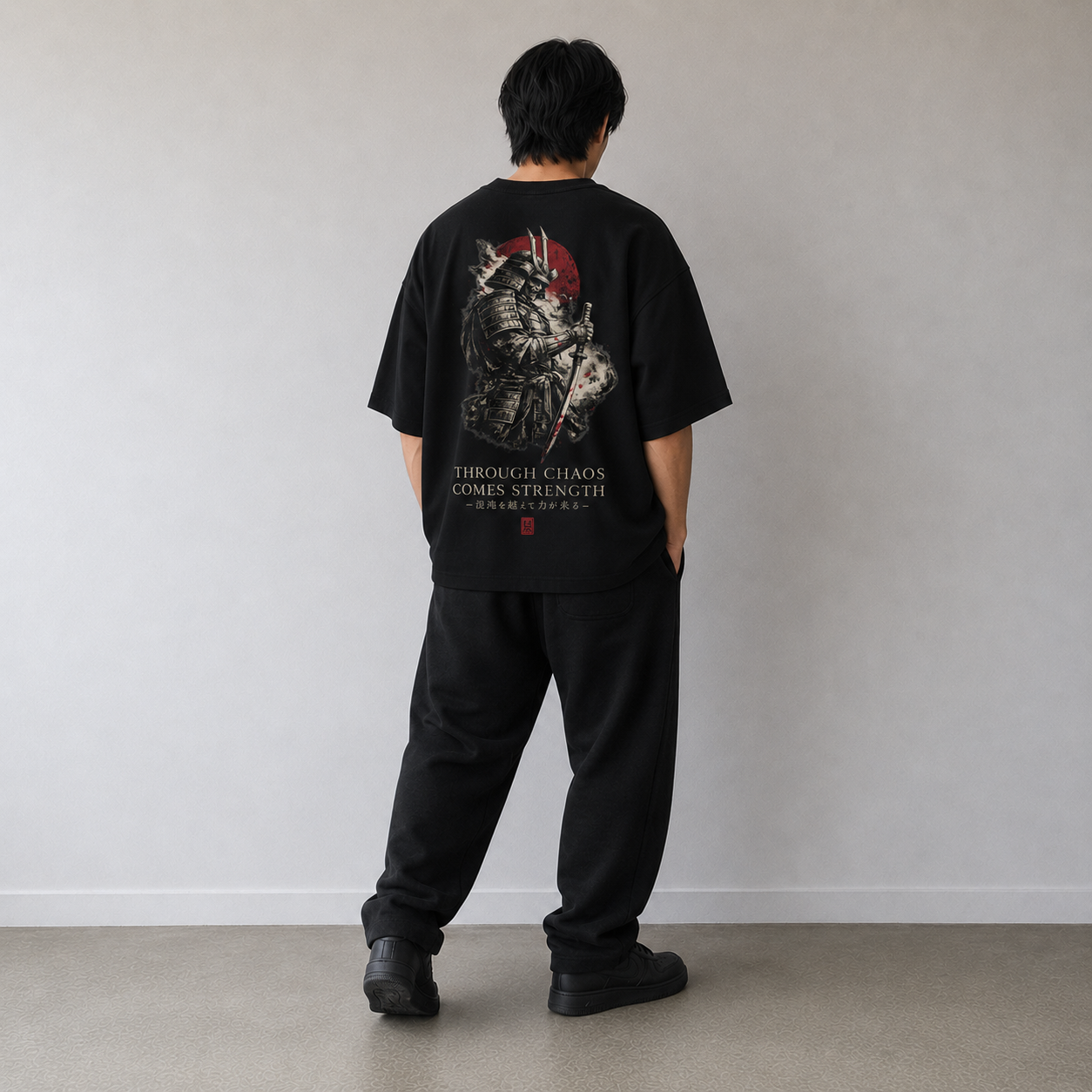 Black oversized KUROGANE t-shirt with CHAOS Strength graphic