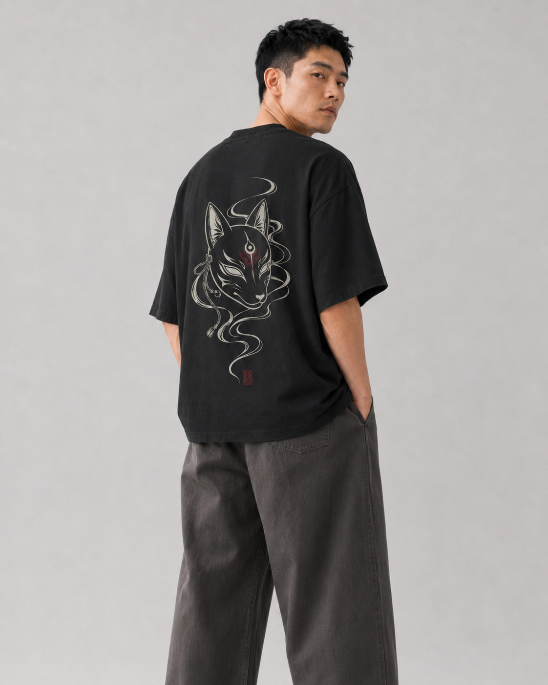 Model wearing the KUROGANE Kitsune Veil heavyweight oversized fox mask T-shirt