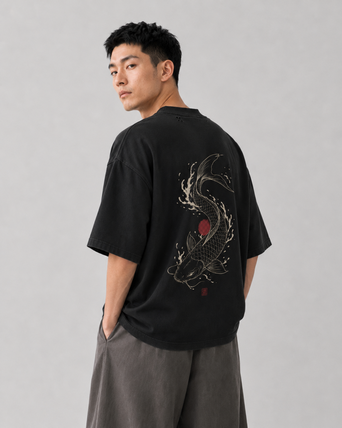 Model wearing the KUROGANE Koi Ascendant heavyweight oversized Japanese koi T-shirt