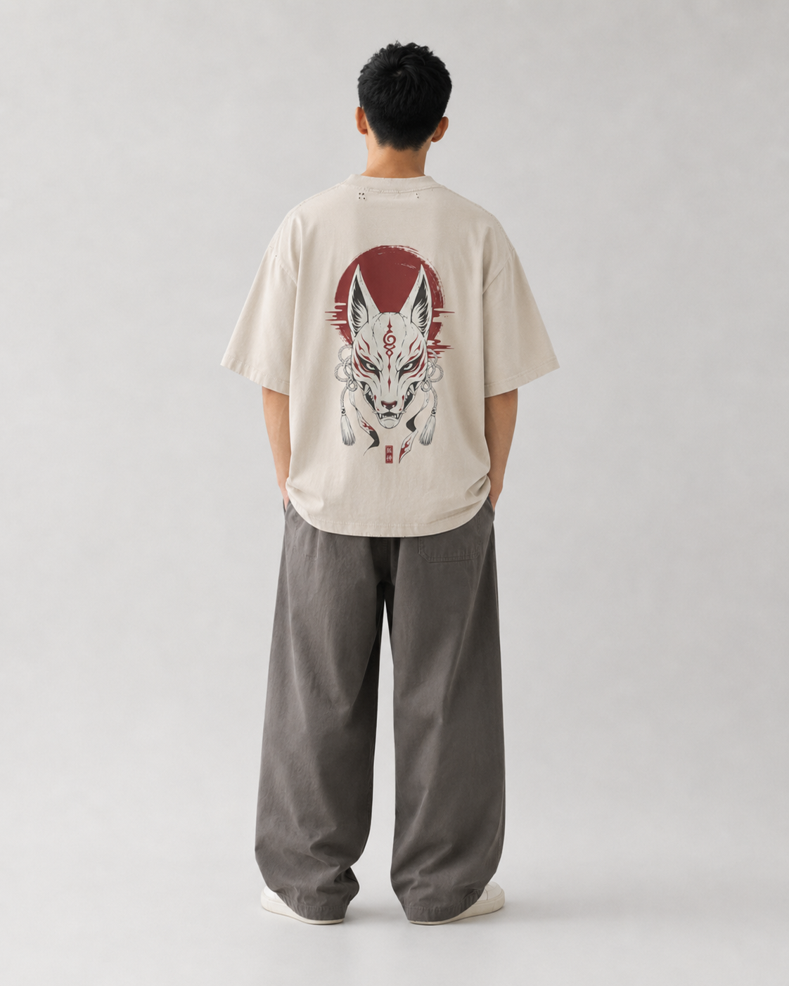 Model wearing the KUROGANE Shattered Oni oversized Japanese oni streetwear tee